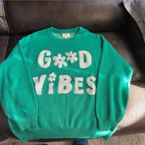 Cozy Green Sweater with White Lettering
